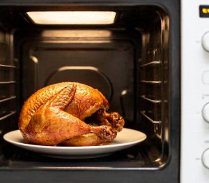 chicken cooking in a microwave