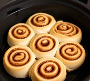 cinnamon rolls cooking in microwave