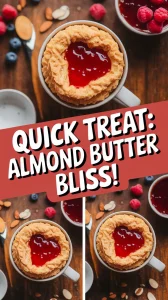 Delicious 2-Minute Microwave Almond Butter and Jelly Mug Cake topped with jelly.
