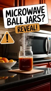 A Ball mason jar with steaming liquid inside, placed near a microwave.