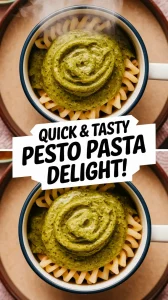Delicious pesto pasta in a mug bowl, showcasing a quick and easy microwave recipe.