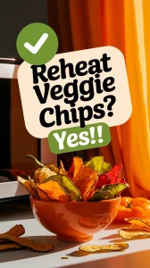 Bowl of colorful veggie chips indicating they can be reheated without sogginess.