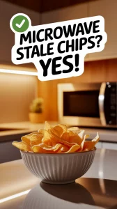Bowl of chips with a sign saying microwave stale chips yes, related to trick for reviving stale chips.